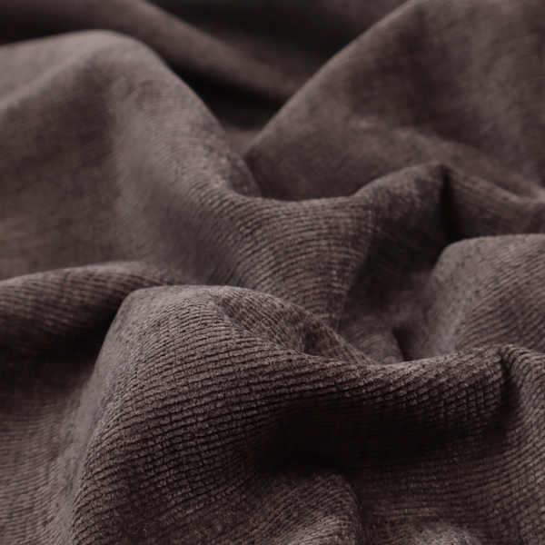 A deep charcoal or cocoa-brown fabric with a heavy horizontal corded texture. The dense, linear weave creates a multi-tonal effect with subtle shadows, offering a sophisticated and cosy tactile appearance.