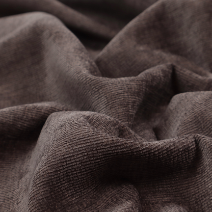 A deep charcoal or cocoa-brown fabric with a heavy horizontal corded texture. The dense, linear weave creates a multi-tonal effect with subtle shadows, offering a sophisticated and cosy tactile appearance.