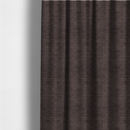 The fabric used to create these made-to-measure curtains is a deep charcoal or cocoa-brown fabric with a heavy horizontal corded texture. The dense, linear weave creates a multi-tonal effect with subtle shadows, offering a sophisticated and cosy tactile appearance.