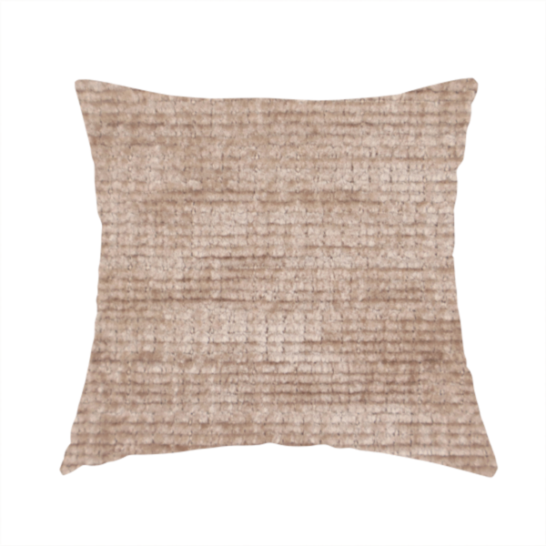The fabric used to create these handmade cushions is a warm rosy-taupe or dusty mauve fabric with a soft, chenille-like horizontal rib. The texture is plush and slightly irregular, creating a comfortable, lived-in look with subtle variations in colour and light.