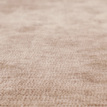 A warm rosy-taupe or dusty mauve fabric with a soft, chenille-like horizontal rib. The texture is plush and slightly irregular, creating a comfortable, lived-in look with subtle variations in colour and light.