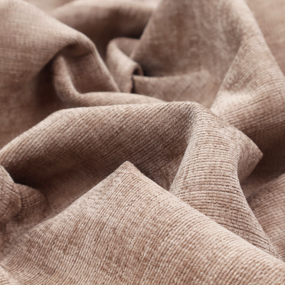 A warm rosy-taupe or dusty mauve fabric with a soft, chenille-like horizontal rib. The texture is plush and slightly irregular, creating a comfortable, lived-in look with subtle variations in colour and light.
