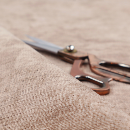 A warm rosy-taupe or dusty mauve fabric with a soft, chenille-like horizontal rib. The texture is plush and slightly irregular, creating a comfortable, lived-in look with subtle variations in colour and light.