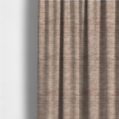 The fabric used to create these made-to-measure curtains is a warm rosy-taupe or dusty mauve fabric with a soft, chenille-like horizontal rib. The texture is plush and slightly irregular, creating a comfortable, lived-in look with subtle variations in colour and light.