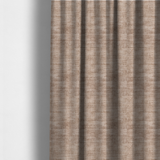 The fabric used to create these made-to-measure curtains is a warm rosy-taupe or dusty mauve fabric with a soft, chenille-like horizontal rib. The texture is plush and slightly irregular, creating a comfortable, lived-in look with subtle variations in colour and light.