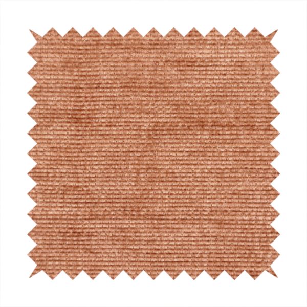 A burnt orange fabric with a dense, horizontal corded texture. The weave has a soft, plush pile similar to corduroy, creating a rich tonal depth with warm highlights and subtle shadows across the linear pattern.