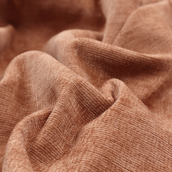 A burnt orange fabric with a dense, horizontal corded texture. The weave has a soft, plush pile similar to corduroy, creating a rich tonal depth with warm highlights and subtle shadows across the linear pattern.