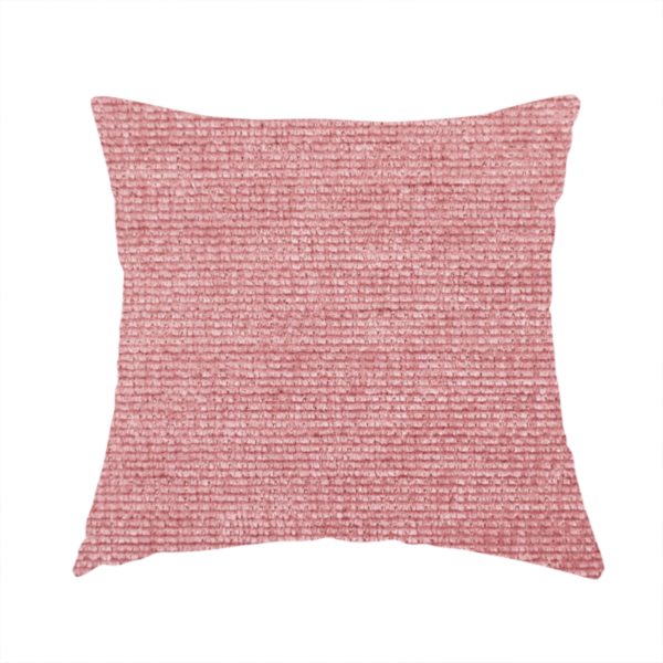 The fabric used to create these handmade cushions is a vibrant mauve-pink or raspberry-toned fabric featuring a dense, horizontal corded texture. The soft, plush weave creates a uniform linear pattern with a subtle velvety sheen that catches the light along each ridge.
