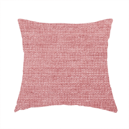 The fabric used to create these handmade cushions is a vibrant mauve-pink or raspberry-toned fabric featuring a dense, horizontal corded texture. The soft, plush weave creates a uniform linear pattern with a subtle velvety sheen that catches the light along each ridge.