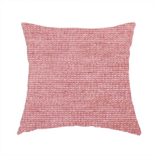 The fabric used to create these handmade cushions is a vibrant mauve-pink or raspberry-toned fabric featuring a dense, horizontal corded texture. The soft, plush weave creates a uniform linear pattern with a subtle velvety sheen that catches the light along each ridge.