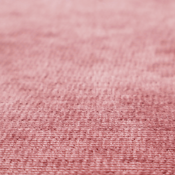 A vibrant mauve-pink or raspberry-toned fabric featuring a dense, horizontal corded texture. The soft, plush weave creates a uniform linear pattern with a subtle velvety sheen that catches the light along each ridge.