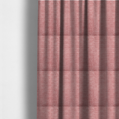 The fabric used to create these made-to-measure curtains is a vibrant mauve-pink or raspberry-toned fabric featuring a dense, horizontal corded texture. The soft, plush weave creates a uniform linear pattern with a subtle velvety sheen that catches the light along each ridge.