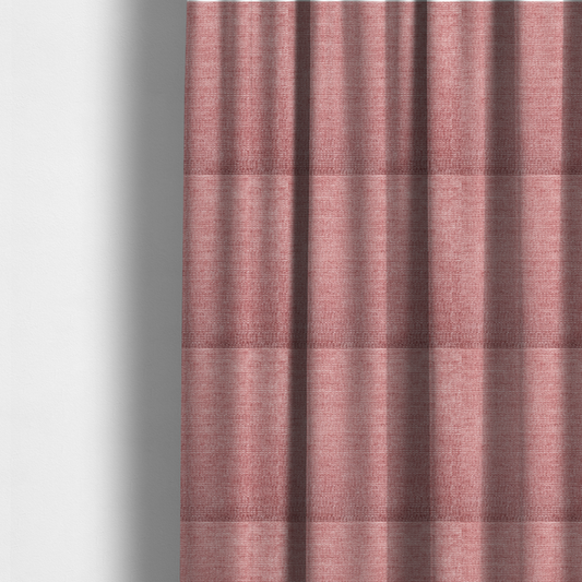 The fabric used to create these made-to-measure curtains is a vibrant mauve-pink or raspberry-toned fabric featuring a dense, horizontal corded texture. The soft, plush weave creates a uniform linear pattern with a subtle velvety sheen that catches the light along each ridge.