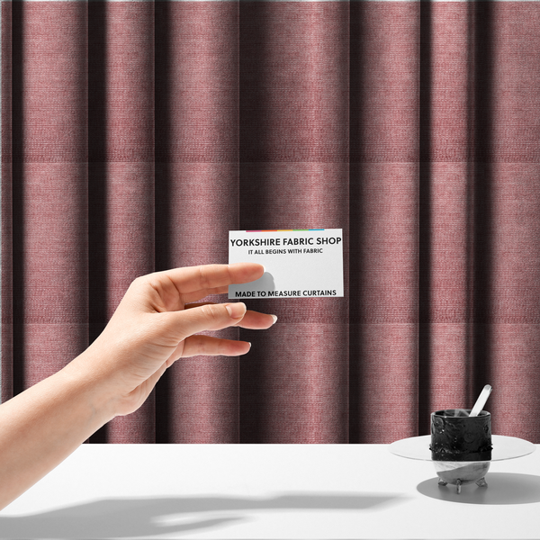 The fabric used to create these made-to-measure curtains is a vibrant mauve-pink or raspberry-toned fabric featuring a dense, horizontal corded texture. The soft, plush weave creates a uniform linear pattern with a subtle velvety sheen that catches the light along each ridge.