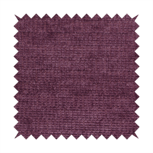 A deep plum or dark berry purple fabric with a rich, textured weave. It features a subtle horizontal grain combined with a soft, mottled pile that creates depth through varying shades of purple and wine, resulting in a plush and sophisticated finish.