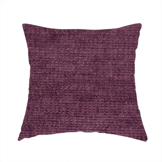 The fabric used to create this handmade cushion is a deep plum or dark berry purple fabric with a rich, textured weave. It features a subtle horizontal grain combined with a soft, mottled pile that creates depth through varying shades of purple and wine, resulting in a plush and sophisticated finish.