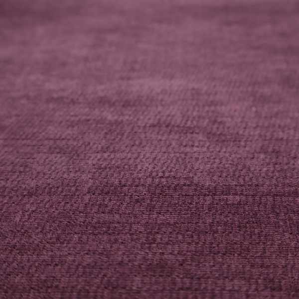 A deep plum or dark berry purple fabric with a rich, textured weave. It features a subtle horizontal grain combined with a soft, mottled pile that creates depth through varying shades of purple and wine, resulting in a plush and sophisticated finish.