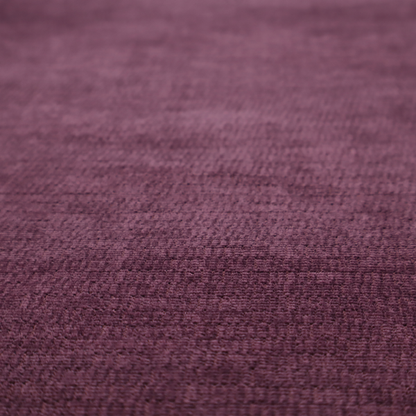 A deep plum or dark berry purple fabric with a rich, textured weave. It features a subtle horizontal grain combined with a soft, mottled pile that creates depth through varying shades of purple and wine, resulting in a plush and sophisticated finish.
