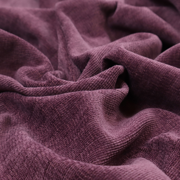 A deep plum or dark berry purple fabric with a rich, textured weave. It features a subtle horizontal grain combined with a soft, mottled pile that creates depth through varying shades of purple and wine, resulting in a plush and sophisticated finish.
