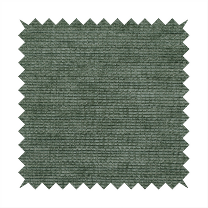 A forest green fabric with a dense horizontal ribbed texture. The weave features a soft, velvety pile that creates a subtle play of light and shadow across the linear ridges, giving the material a rich, organic feel.