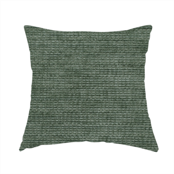 The fabric used to create these handmade cushions is a forest green fabric with a dense horizontal ribbed texture. The weave features a soft, velvety pile that creates a subtle play of light and shadow across the linear ridges, giving the material a rich, organic feel.