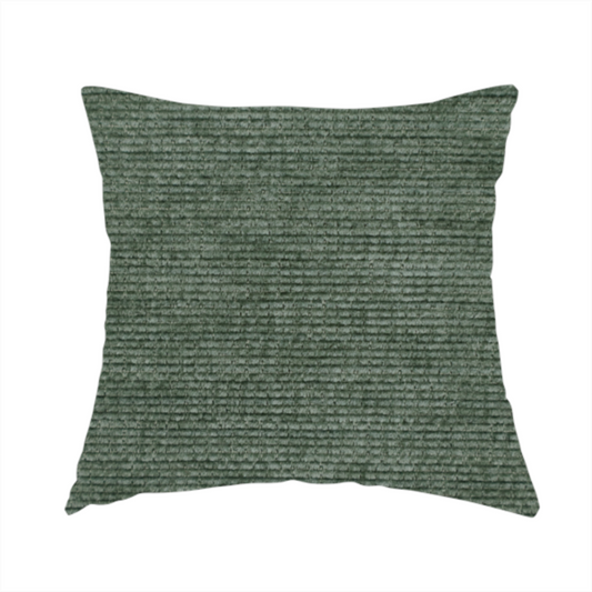 The fabric used to create these handmade cushions is a forest green fabric with a dense horizontal ribbed texture. The weave features a soft, velvety pile that creates a subtle play of light and shadow across the linear ridges, giving the material a rich, organic feel.