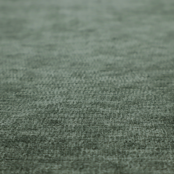 A forest green fabric with a dense horizontal ribbed texture. The weave features a soft, velvety pile that creates a subtle play of light and shadow across the linear ridges, giving the material a rich, organic feel.