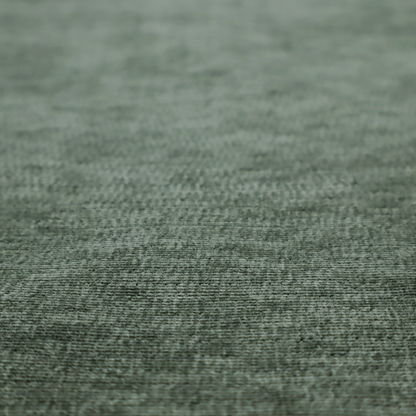 A forest green fabric with a dense horizontal ribbed texture. The weave features a soft, velvety pile that creates a subtle play of light and shadow across the linear ridges, giving the material a rich, organic feel.