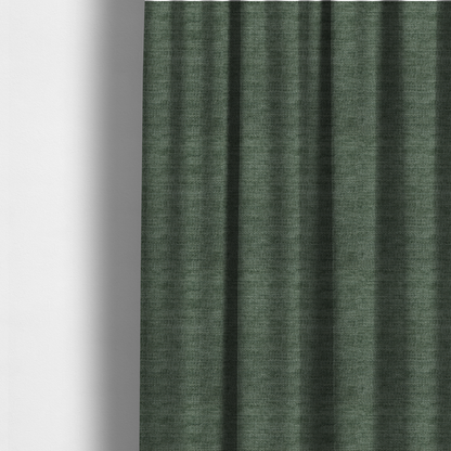 The fabric used to create these made-to-measure curtains is a forest green fabric with a dense horizontal ribbed texture. The weave features a soft, velvety pile that creates a subtle play of light and shadow across the linear ridges, giving the material a rich, organic feel.