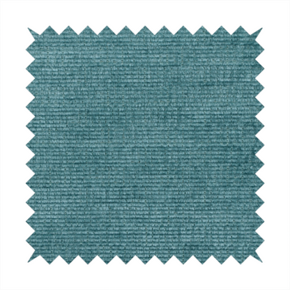 A deep peacock blue fabric with a structured horizontal corded texture. The plush, velvety ridges create a dense linear pattern, offering a sophisticated play of light and shadow with a soft, durable finish.