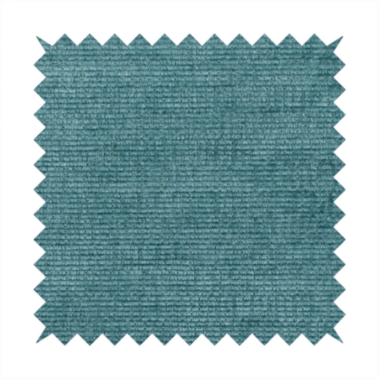 A deep peacock blue fabric with a structured horizontal corded texture. The plush, velvety ridges create a dense linear pattern, offering a sophisticated play of light and shadow with a soft, durable finish.