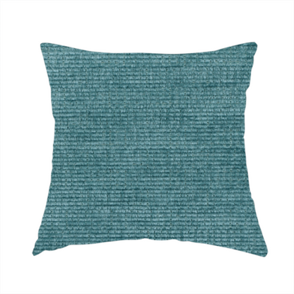 The fabric used to create these handmade cushions is a deep peacock blue fabric with a structured horizontal corded texture. The plush, velvety ridges create a dense linear pattern, offering a sophisticated play of light and shadow with a soft, durable finish.