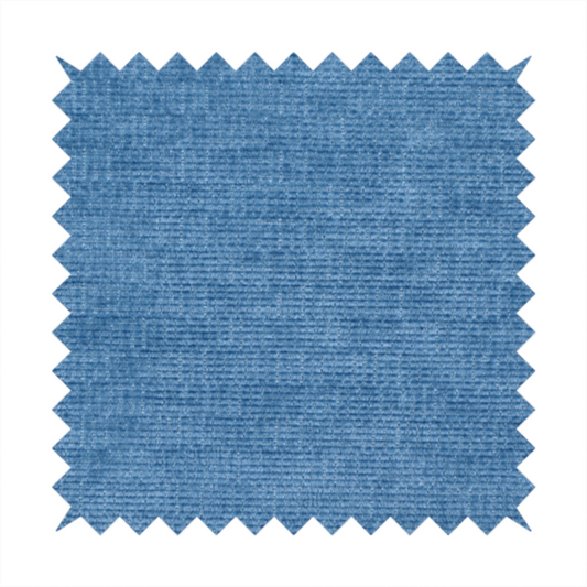 A vibrant mid-blue or cornflower blue fabric featuring a dense horizontal corded texture. The weave has a soft, plush finish with a subtle velvety sheen that creates light-catching highlights across the uniform linear ridges.