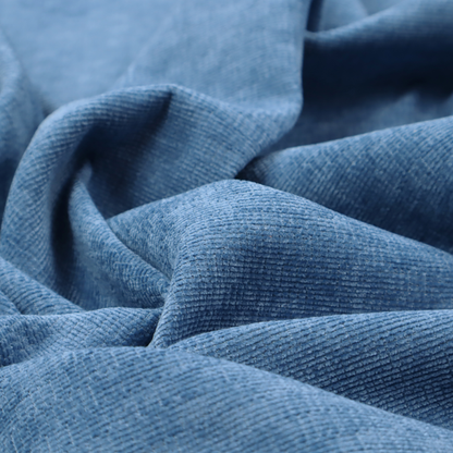 A vibrant mid-blue or cornflower blue fabric featuring a dense horizontal corded texture. The weave has a soft, plush finish with a subtle velvety sheen that creates light-catching highlights across the uniform linear ridges.
