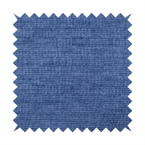 A deep royal blue or indigo fabric with a dense horizontal ribbed texture. The weave features a soft, plush pile that creates a multi-tonal effect with rich shadows and mid-tone blue highlights across the linear ridges.
