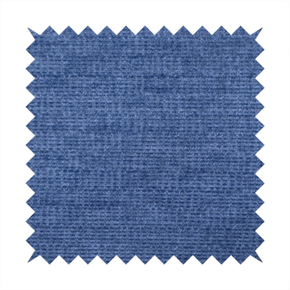 A deep royal blue or indigo fabric with a dense horizontal ribbed texture. The weave features a soft, plush pile that creates a multi-tonal effect with rich shadows and mid-tone blue highlights across the linear ridges.