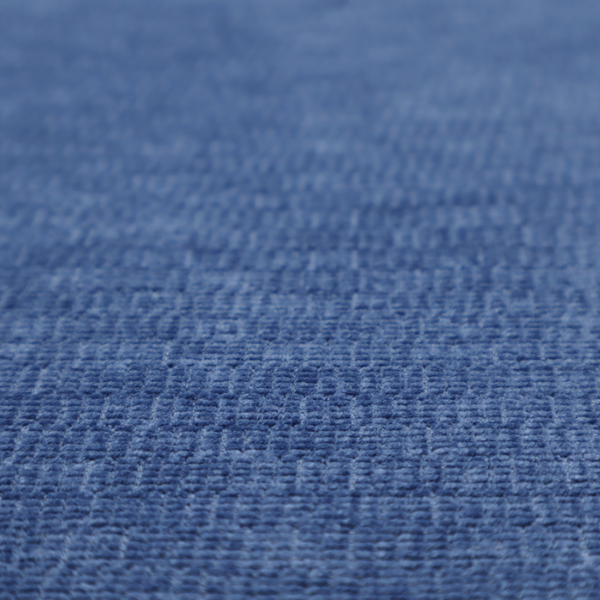 A deep royal blue or indigo fabric with a dense horizontal ribbed texture. The weave features a soft, plush pile that creates a multi-tonal effect with rich shadows and mid-tone blue highlights across the linear ridges.