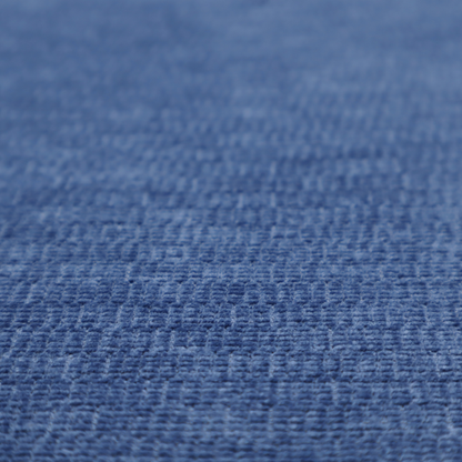 A deep royal blue or indigo fabric with a dense horizontal ribbed texture. The weave features a soft, plush pile that creates a multi-tonal effect with rich shadows and mid-tone blue highlights across the linear ridges.