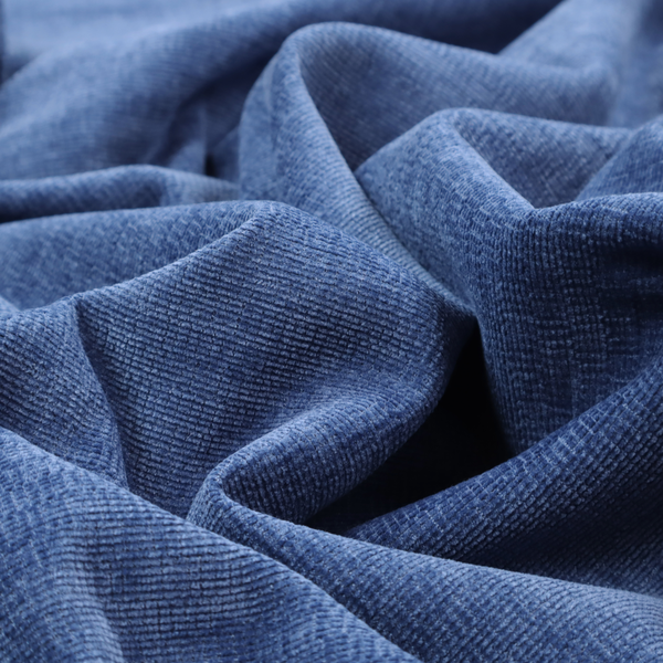 A deep royal blue or indigo fabric with a dense horizontal ribbed texture. The weave features a soft, plush pile that creates a multi-tonal effect with rich shadows and mid-tone blue highlights across the linear ridges.