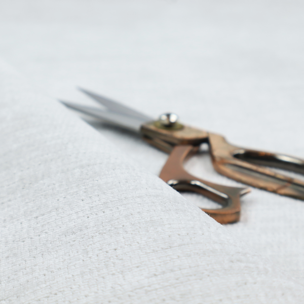 A cool, silver-white fabric with a soft, uniform horizontal ribbed texture. The material features a plush, chenille-like pile that provides a subtle, velvety sheen, catching the light across the fine linear ridges for a clean and modern look.