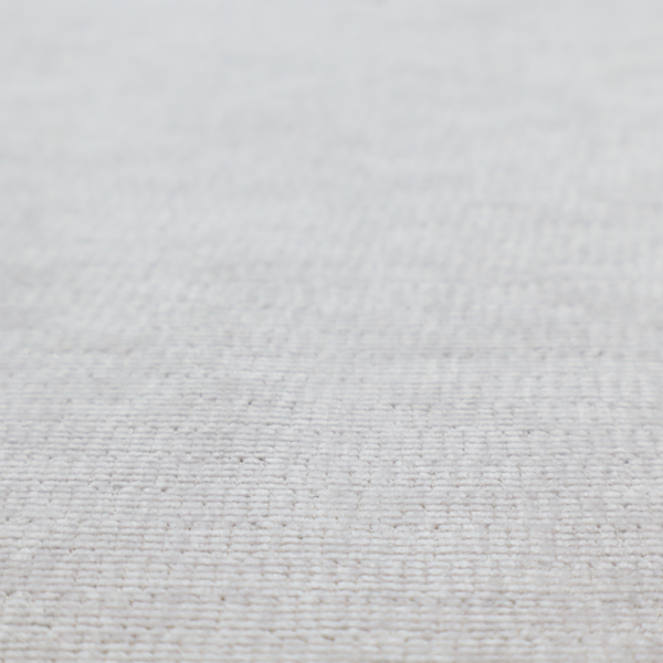 A light grey fabric with a soft, uniform horizontal ribbed texture. The weave has a plush, velvety pile that creates subtle shadows and highlights across the linear ridges, providing a clean, modern aesthetic with a tactile feel.