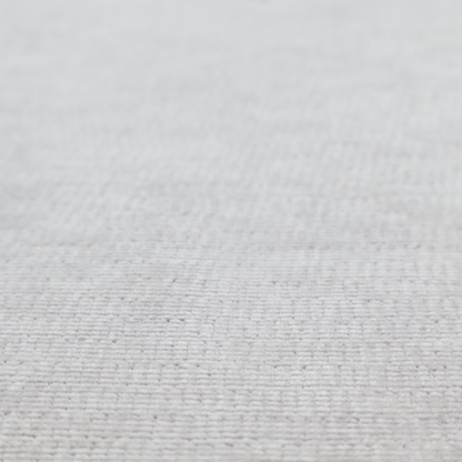 A light grey fabric with a soft, uniform horizontal ribbed texture. The weave has a plush, velvety pile that creates subtle shadows and highlights across the linear ridges, providing a clean, modern aesthetic with a tactile feel.