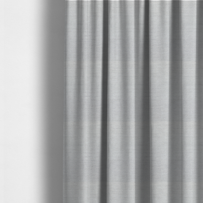 The fabric used to create these made-to-measure curtains is a light grey fabric with a soft, uniform horizontal ribbed texture. The weave has a plush, velvety pile that creates subtle shadows and highlights across the linear ridges, providing a clean, modern aesthetic with a tactile feel.