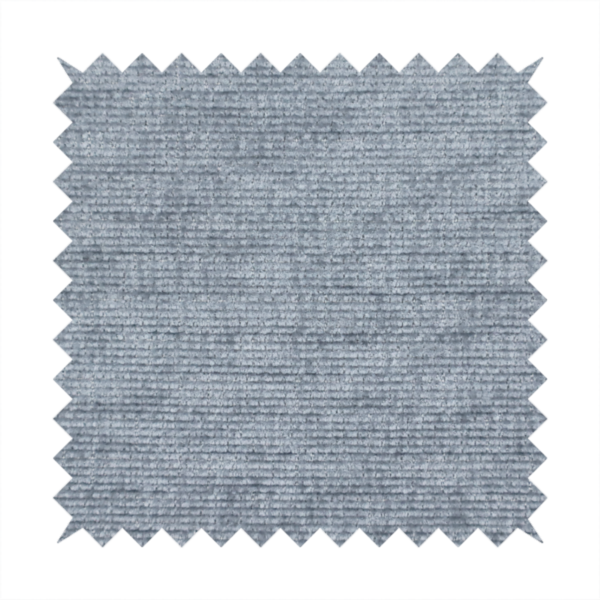 A slate grey fabric with a dense horizontal ribbed texture. The material features a plush, velvety pile with subtle mottled highlights, creating a rich, tactile surface that offers both depth and a modern, clean aesthetic.