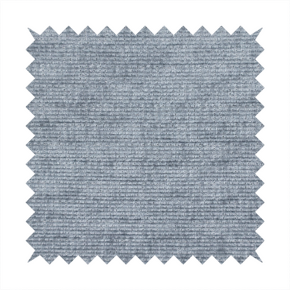 A slate grey fabric with a dense horizontal ribbed texture. The material features a plush, velvety pile with subtle mottled highlights, creating a rich, tactile surface that offers both depth and a modern, clean aesthetic.