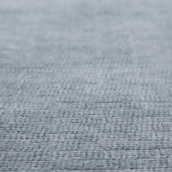 A slate grey fabric with a dense horizontal ribbed texture. The material features a plush, velvety pile with subtle mottled highlights, creating a rich, tactile surface that offers both depth and a modern, clean aesthetic.