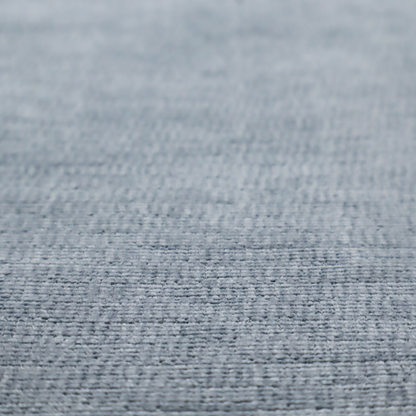 A slate grey fabric with a dense horizontal ribbed texture. The material features a plush, velvety pile with subtle mottled highlights, creating a rich, tactile surface that offers both depth and a modern, clean aesthetic.