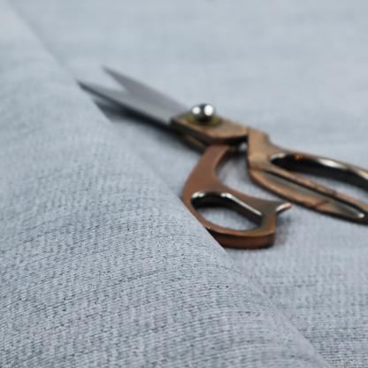 A slate grey fabric with a dense horizontal ribbed texture. The material features a plush, velvety pile with subtle mottled highlights, creating a rich, tactile surface that offers both depth and a modern, clean aesthetic.