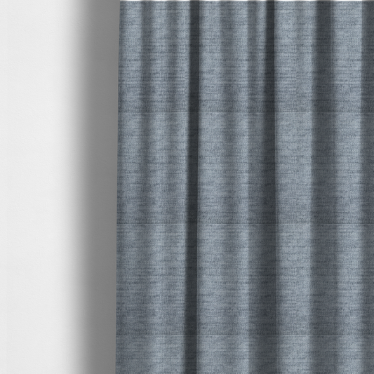 The fabric used to create these made-to-measure curtains is a slate grey fabric with a dense horizontal ribbed texture. The material features a plush, velvety pile with subtle mottled highlights, creating a rich, tactile surface that offers both depth and a modern, clean aesthetic.