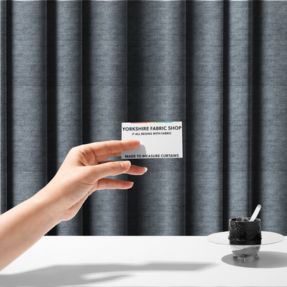 The fabric used to create these made-to-measure curtains is a slate grey fabric with a dense horizontal ribbed texture. The material features a plush, velvety pile with subtle mottled highlights, creating a rich, tactile surface that offers both depth and a modern, clean aesthetic.